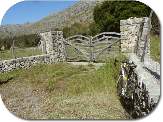 The hire bike and a rustic gate